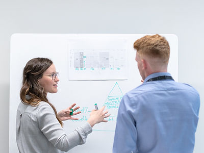 Senior engineers discussing operational telemetry data in a conference room